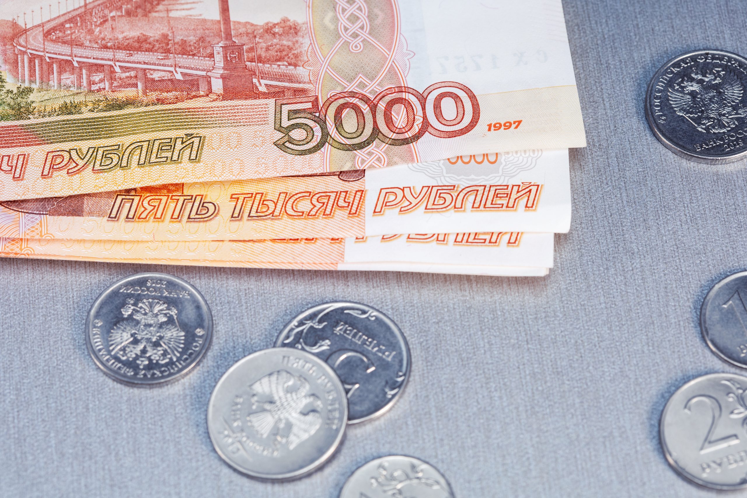 Top view of russian rubles banknotes and coins.