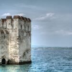beautiful-shot-ancient-historic-building-ocean-sirmione-italy-scaled